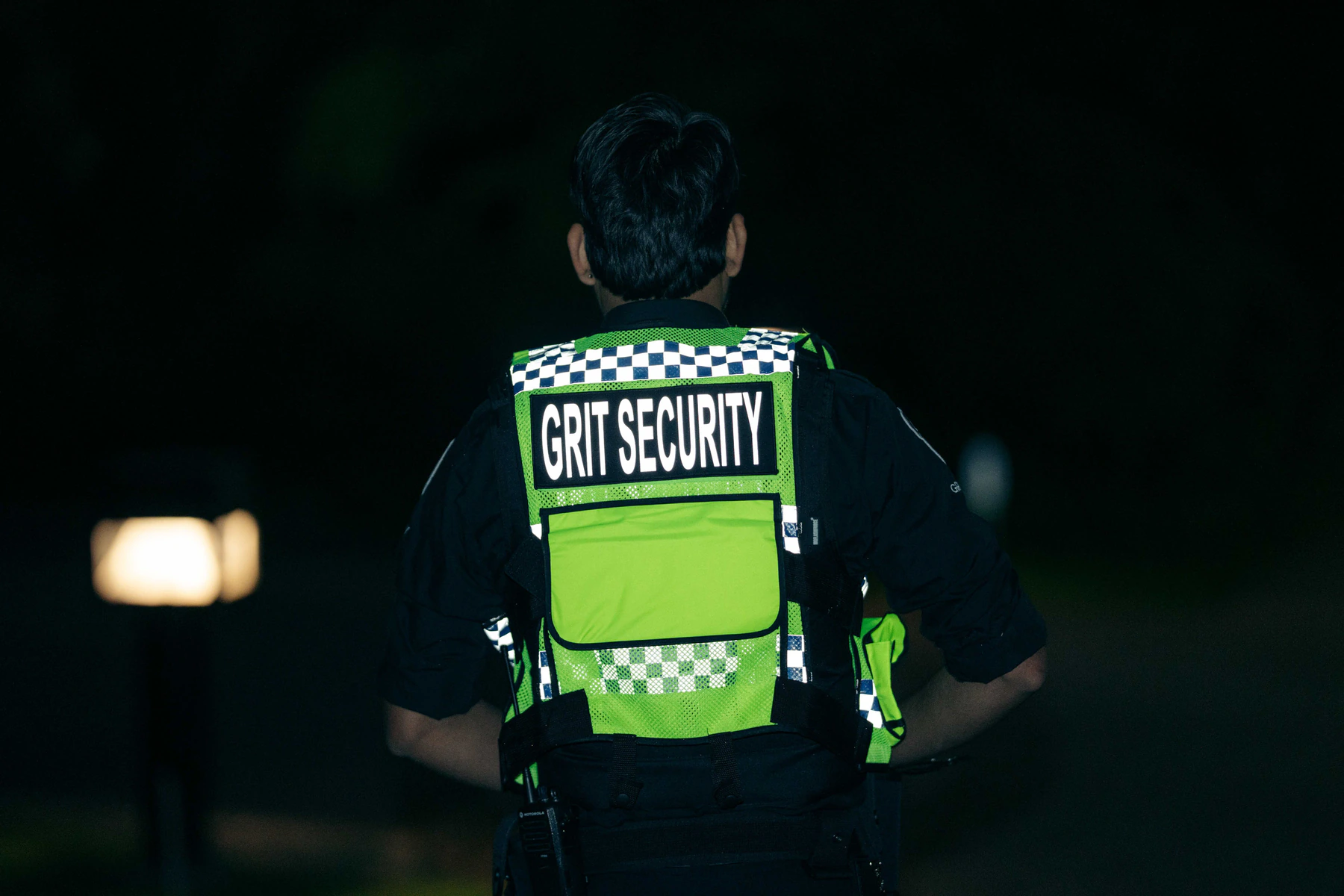 Security officer monitoring access at an active construction project