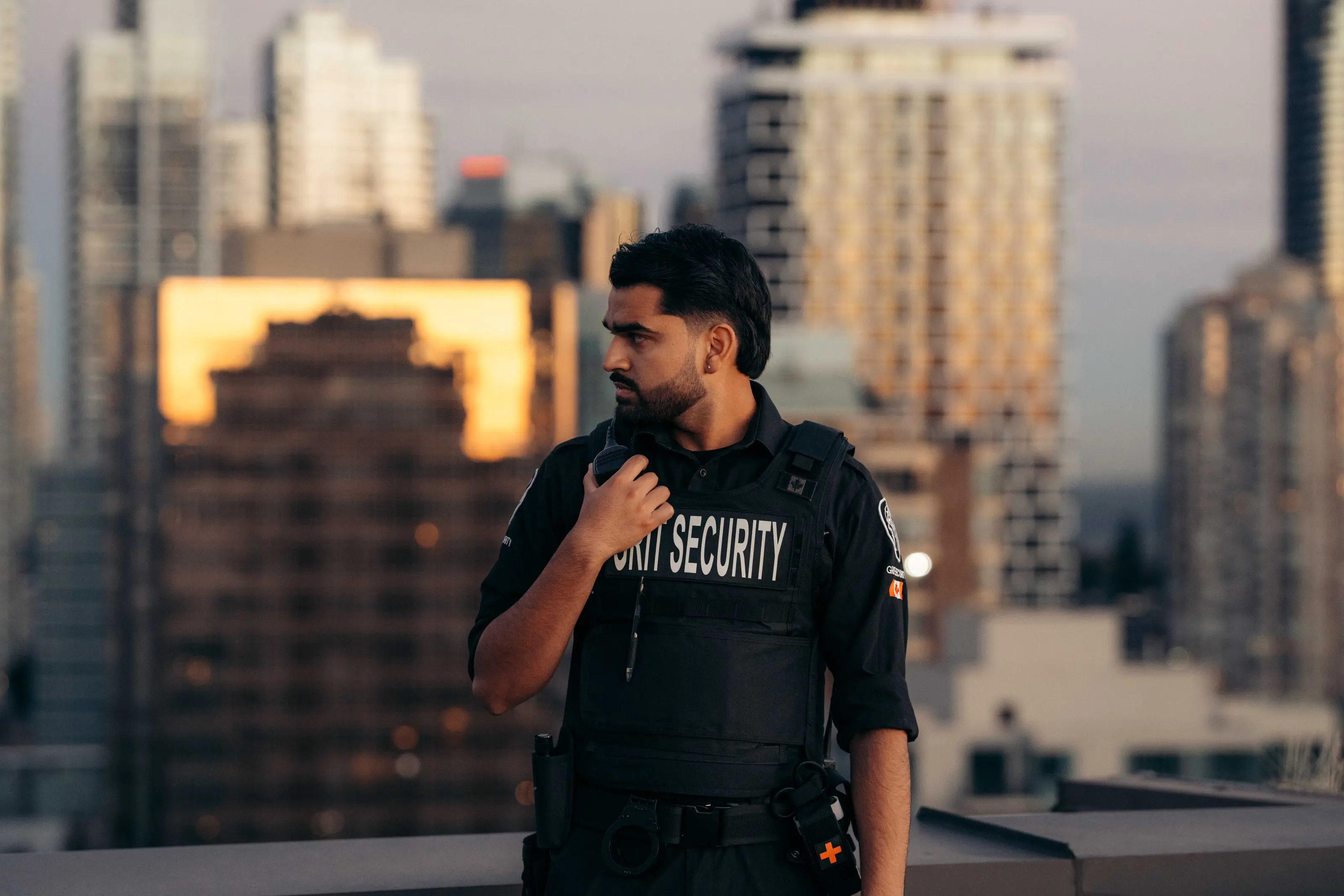 Grit Security officer on patrol above a residential cityscape.
