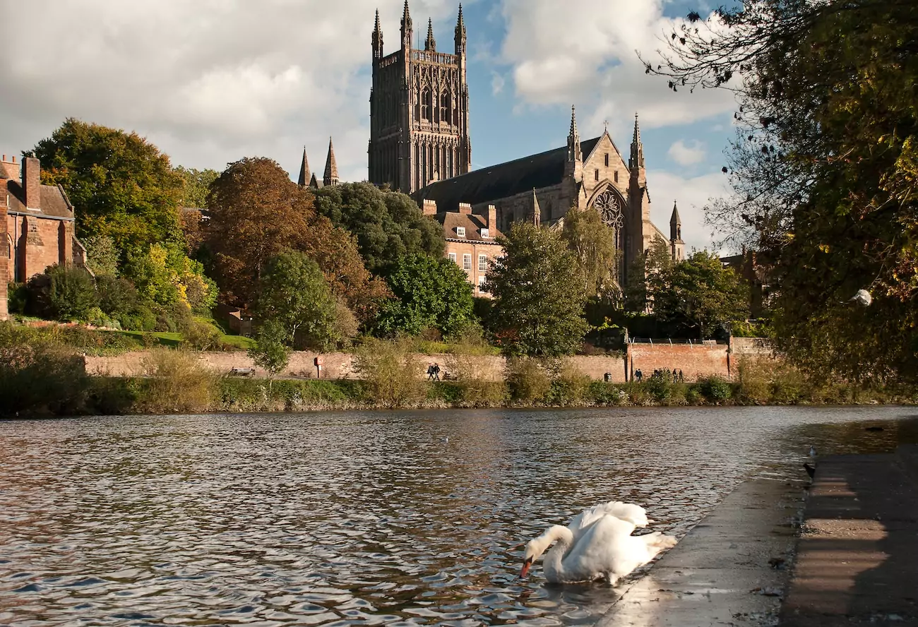 Shot of Worcester Cathedral from river on autumn day.