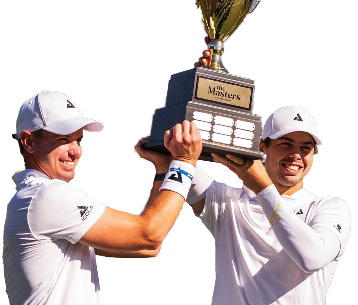 Two male athletes in white sportswear smiling and holding up a large trophy labeled "The Masters" in celebration.
