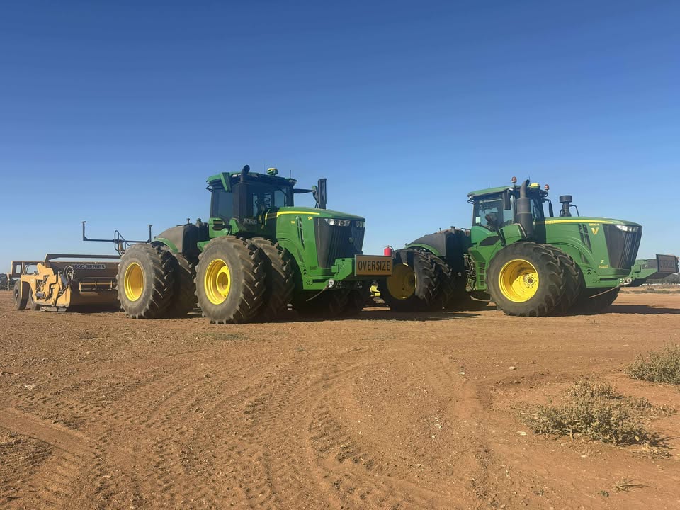 image of a tractor plowing a field