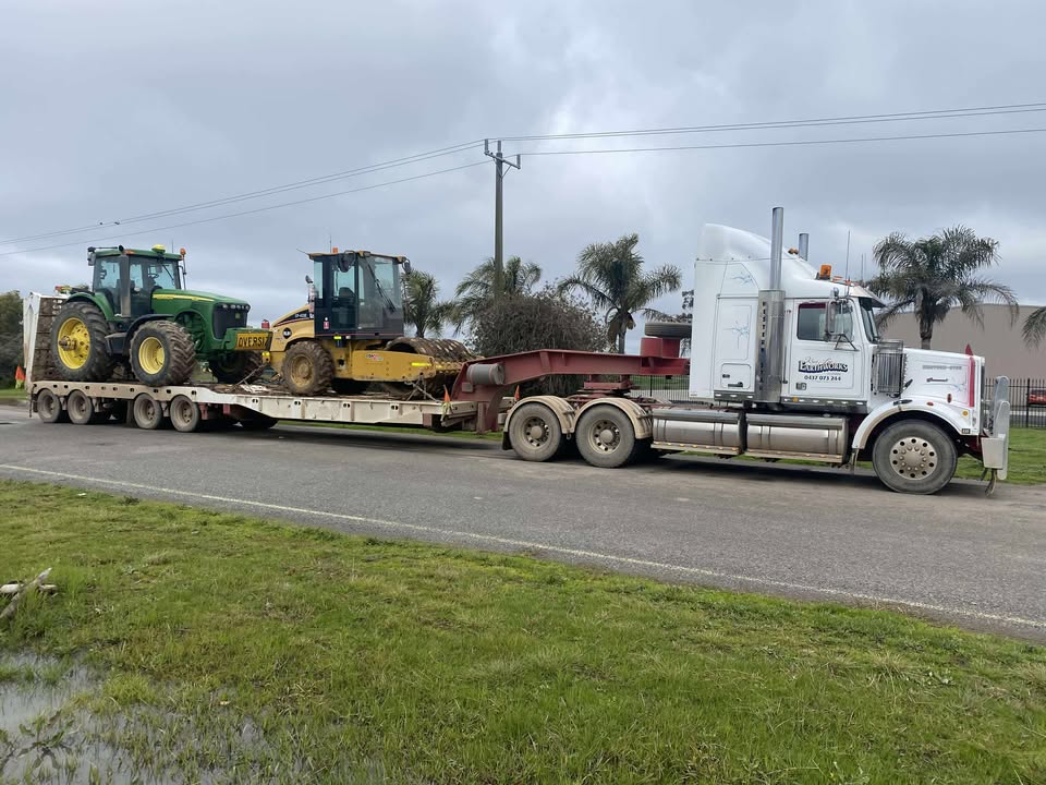 image of a tractor plowing a field