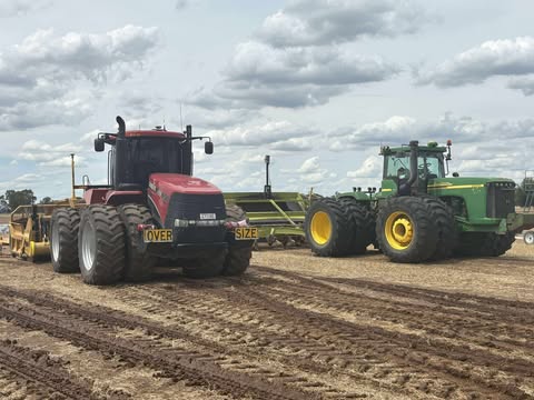 image of a tractor plowing a field
