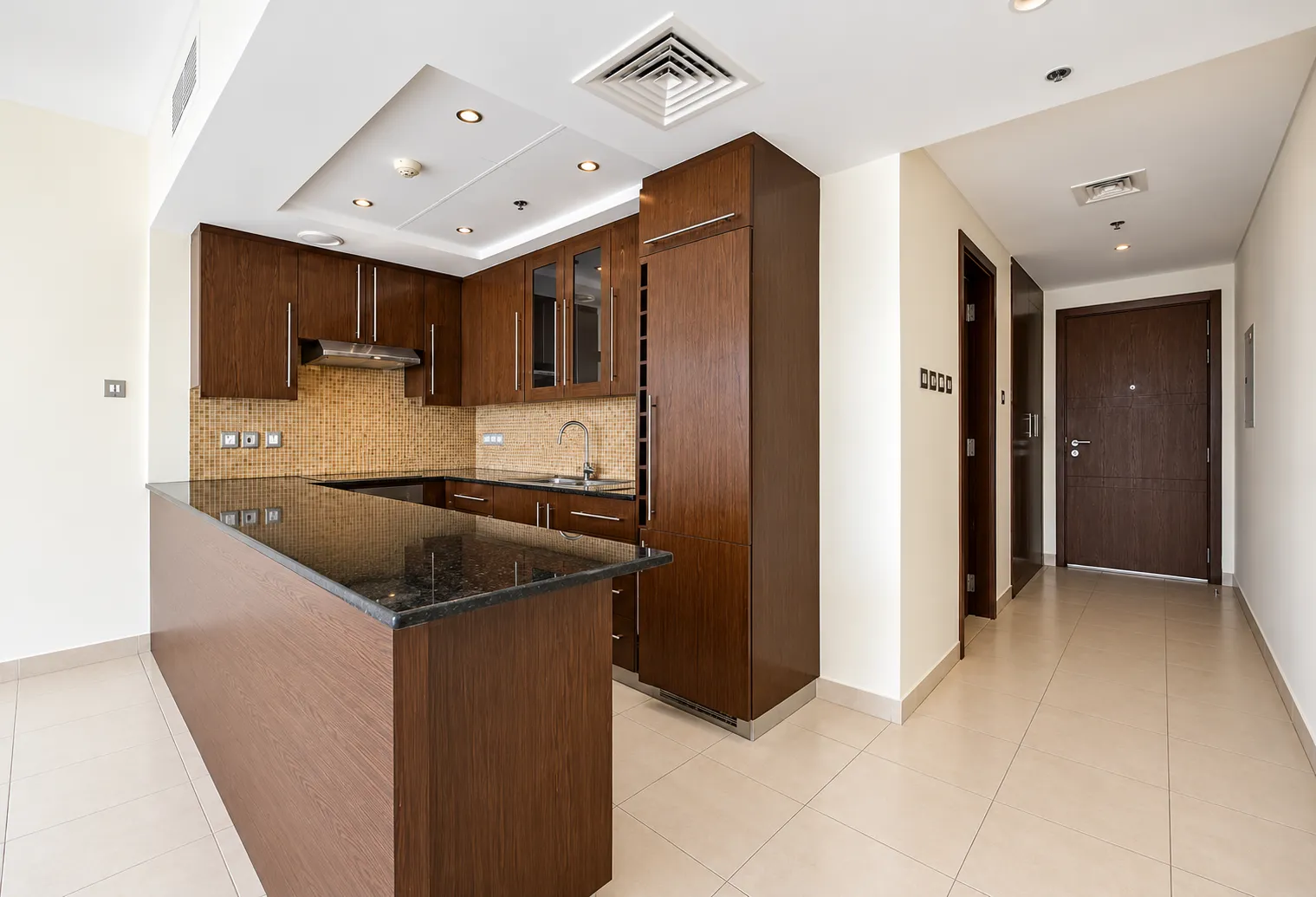 Kitchen before renovation in a Downtown Dubai apartment
