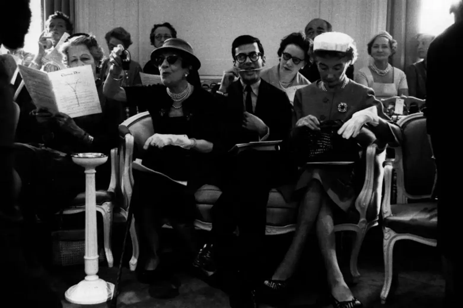 A picture of Marie Louise Bousquet, Paris Editor of Harper's Bazaar, US photographer Richard Avedon, and Carmel Snow, Editor in Chief of Harper's Bazaar at a Dior fashion show in Paris (left to right) A picture of Marie Louise Bousquet, Paris Editor of Harper's Bazaar, US photographer Richard Avedon, and Carmel Snow, Editor in Chief of Harper's Bazaar at a Dior fashion show in Paris (left to right)