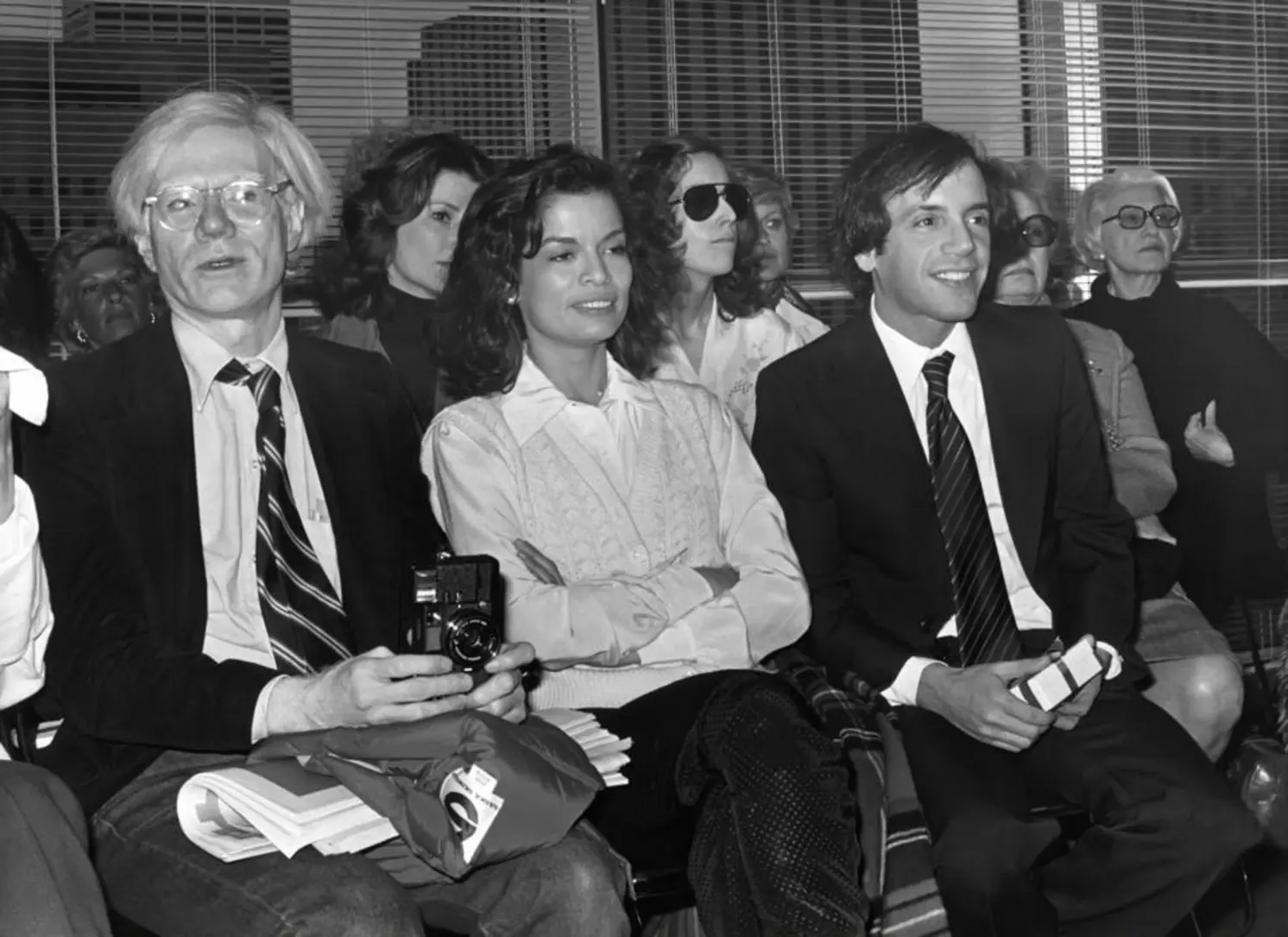 Andy Warhol, Bianca Jagger and Steve Rubell in the front row of the Halston fashion show circa 1978 in New York City Andy Warhol, Bianca Jagger and Steve Rubell in the front row of the Halston fashion show circa 1978 in New York City