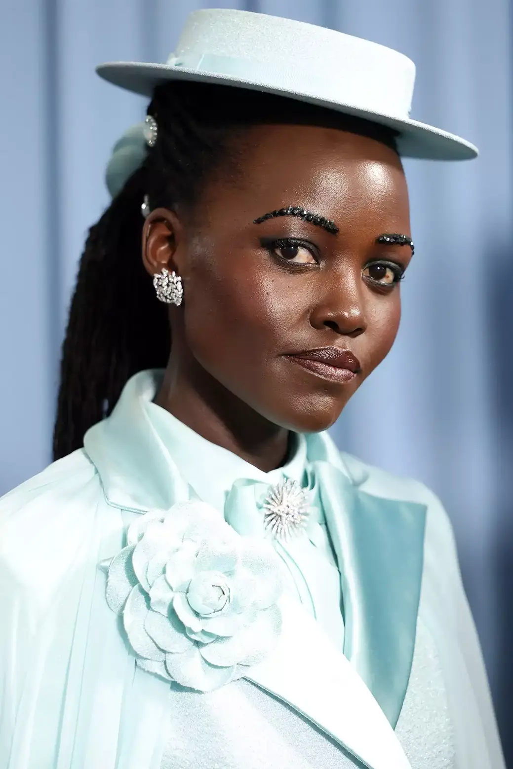 Lupita Nyong'o (The Black Panther: Wakanda Forever actress) wore a button down shirt in the pastel green and added a matching bow tie in the shade with a shimmering crystal brooch at its center Lupita Nyong'o (The Black Panther: Wakanda Forever actress) wore a button down shirt in the pastel green and added a matching bow tie in the shade with a shimmering crystal brooch at its center