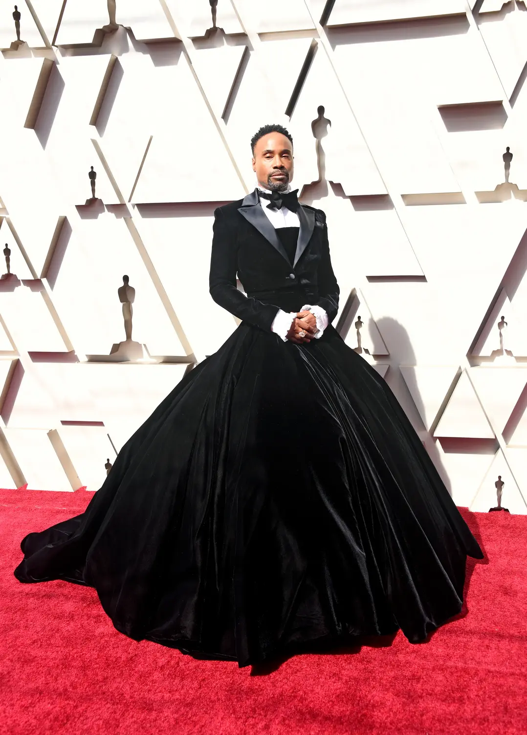 Billy Porter in a black velvet tuxedo gown by Christian Siriano