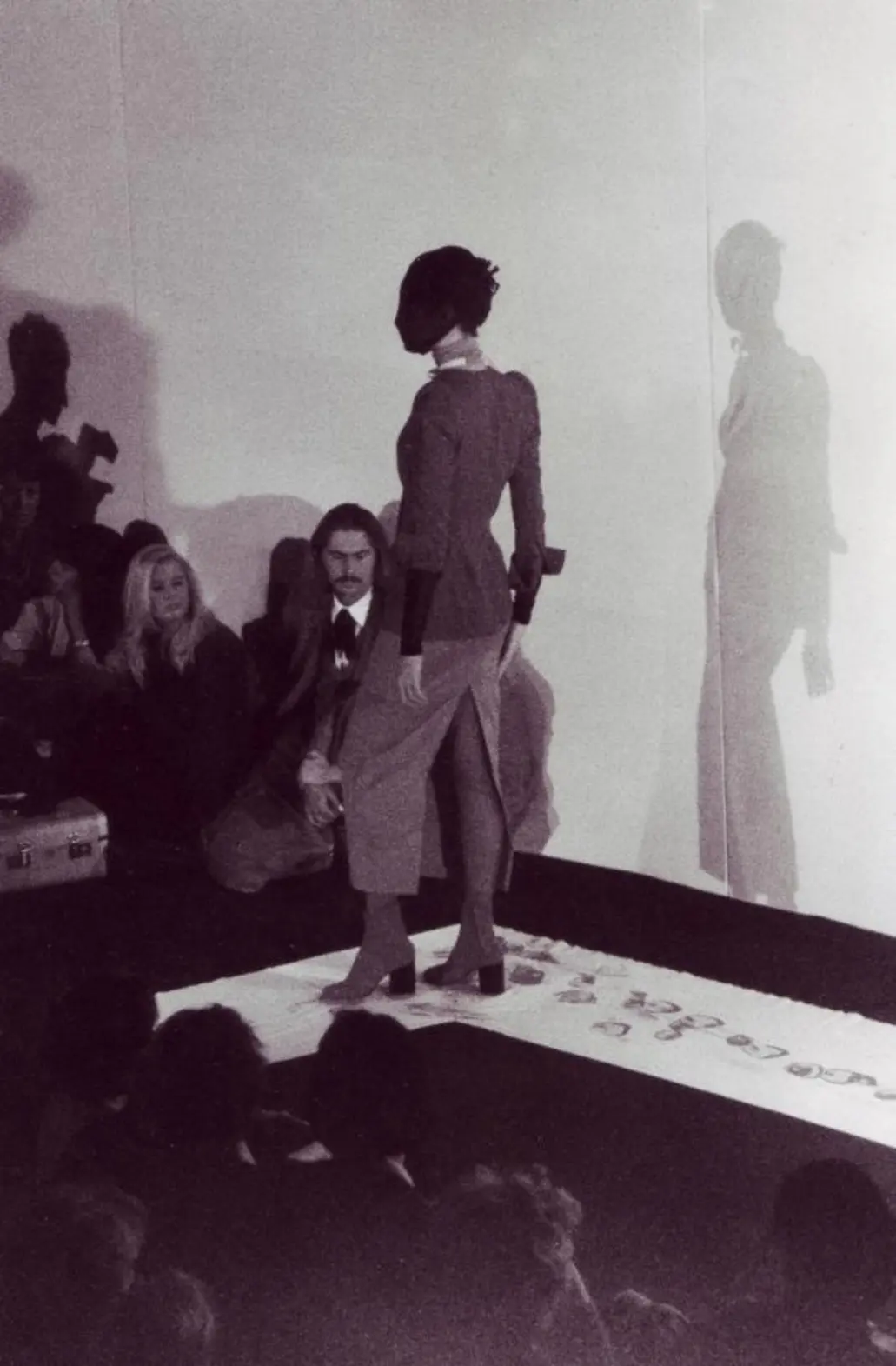 The models wore white Tabi boots dipped in red paint, leaving split-toe footprints on the runway during Margiela's 1988 Debut Runway Show, Spring/Summer 1989