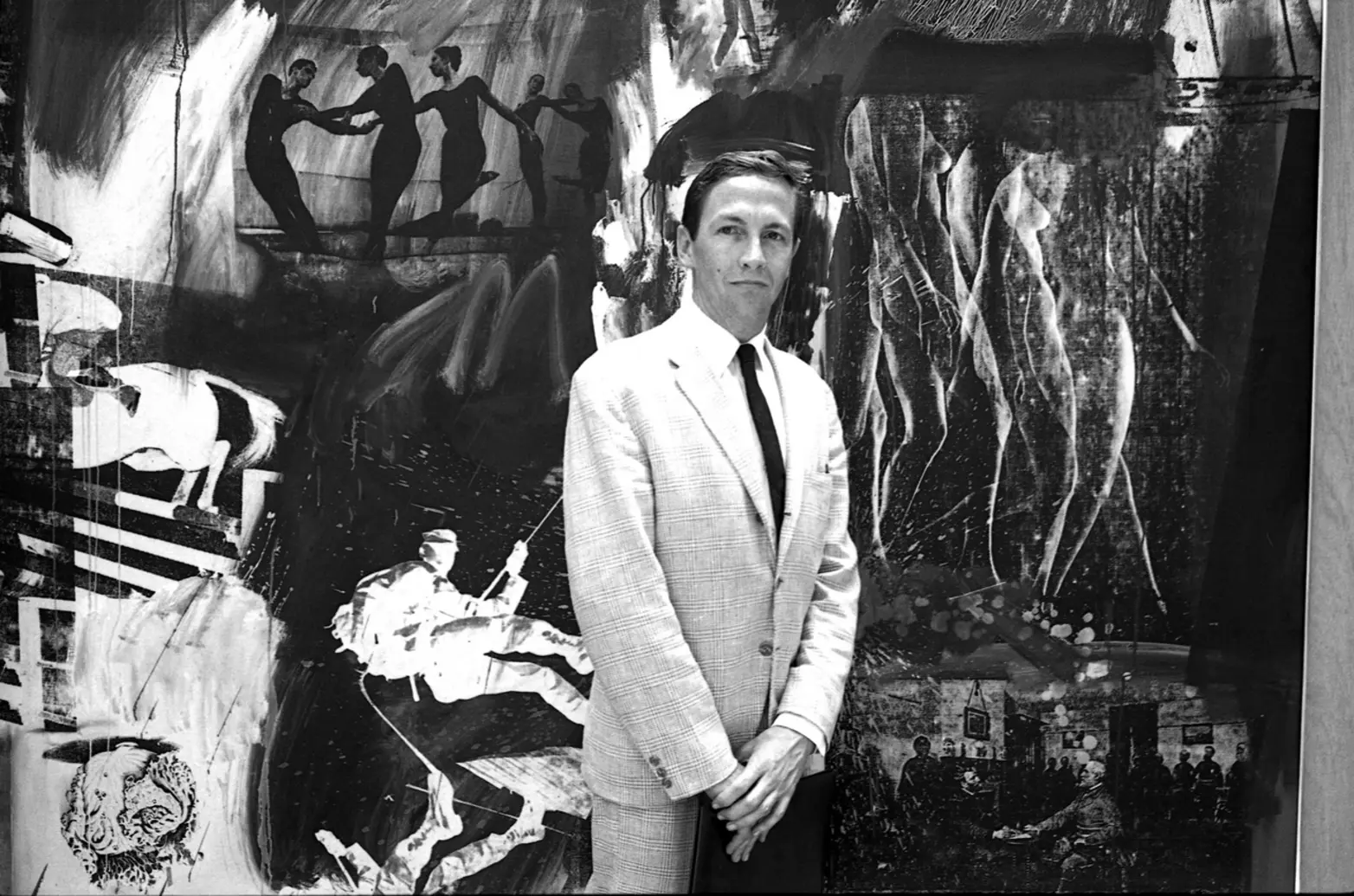 Robert Rauschenberg in front of his silkscreen painting Robert Rauschenberg in front of his silkscreen painting