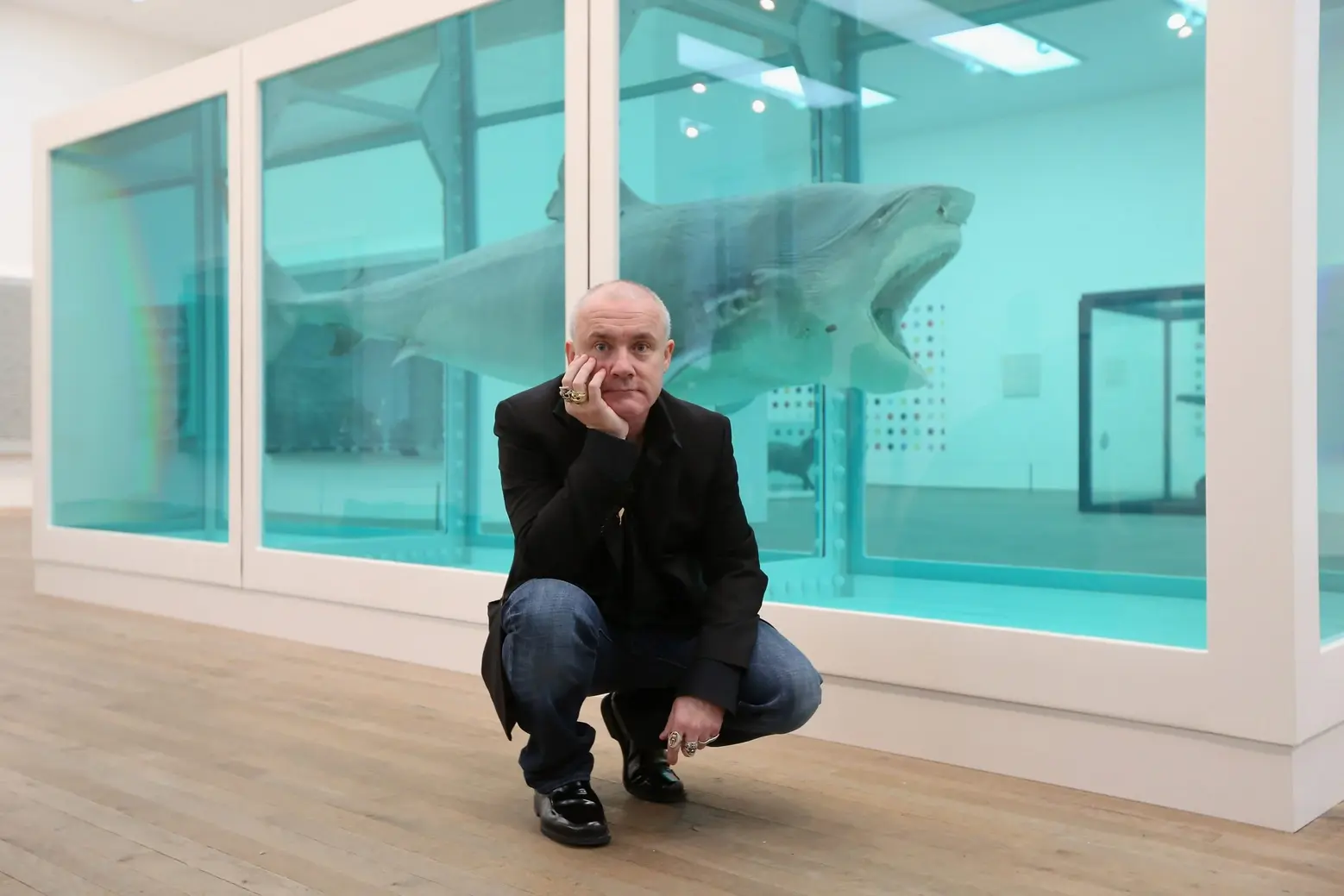Damian Hirst with his work Damian Hirst with his work