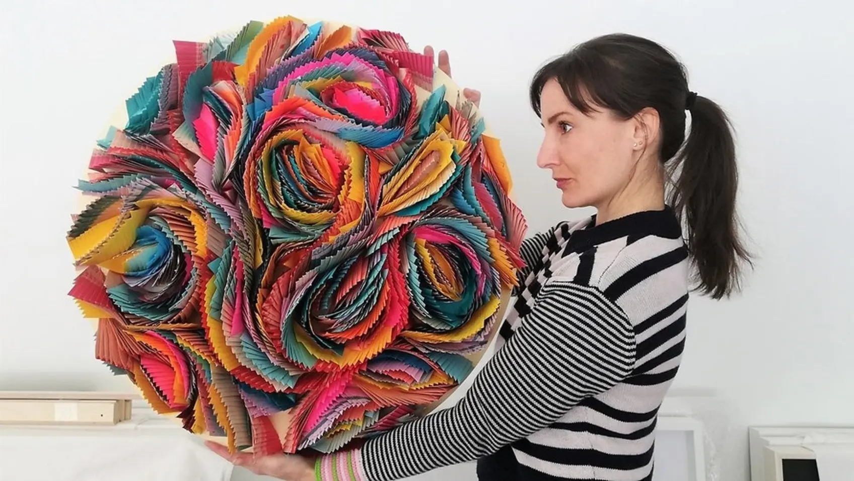 Karine Demers holding her origami-inspired sculpture