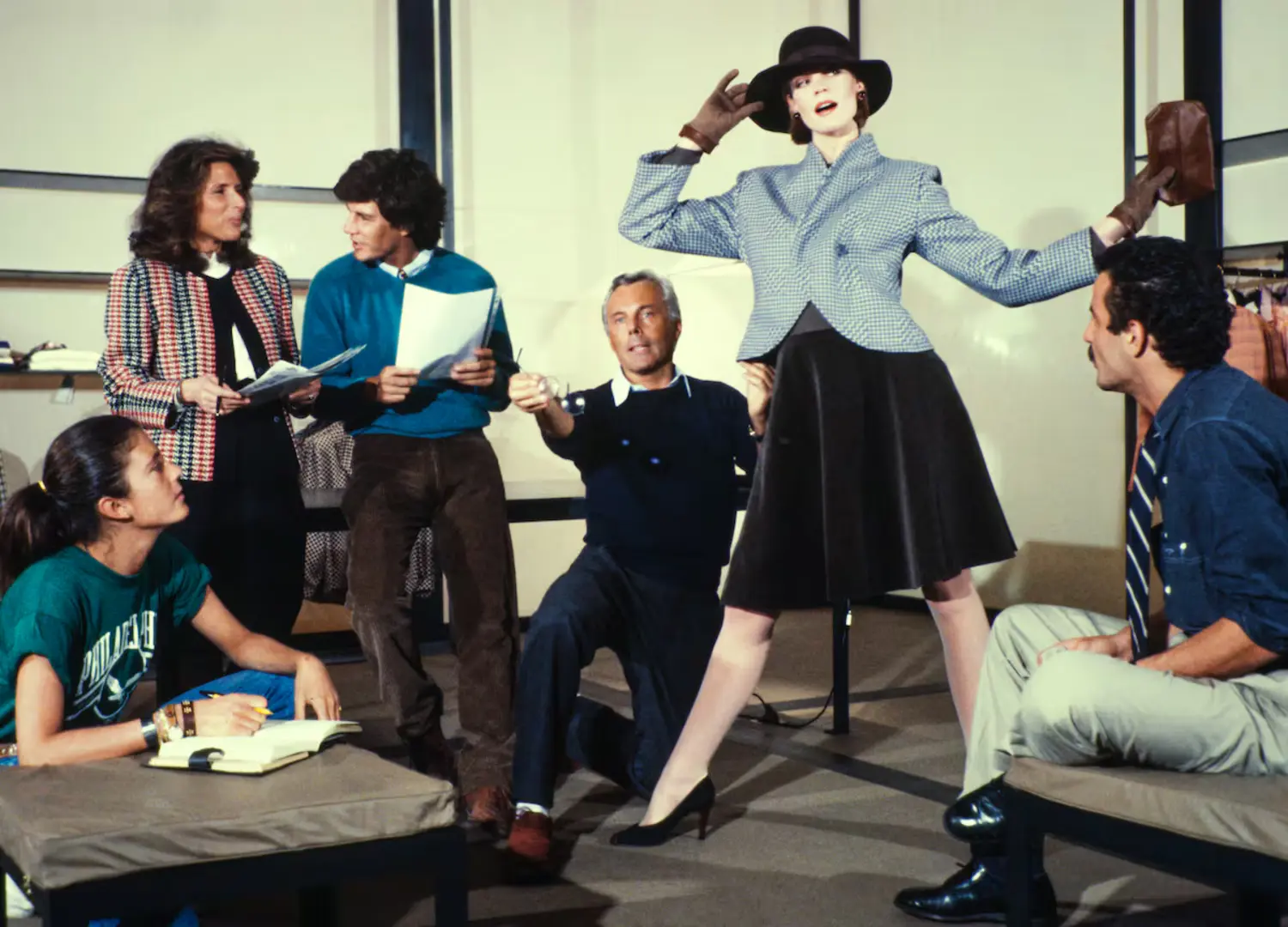 Giorgio Armani appearing during a fashion or business presentation held in Milan in the spring of 1983