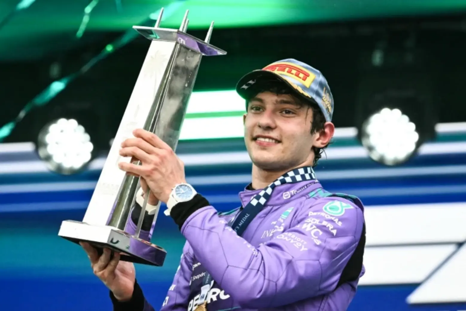 Mercedes driver Kimi Antonelli holds the trophy as he celebrates on the podium after the 2026 F1 Miami Grand Prix F1 Miami Grand Prix cultural events