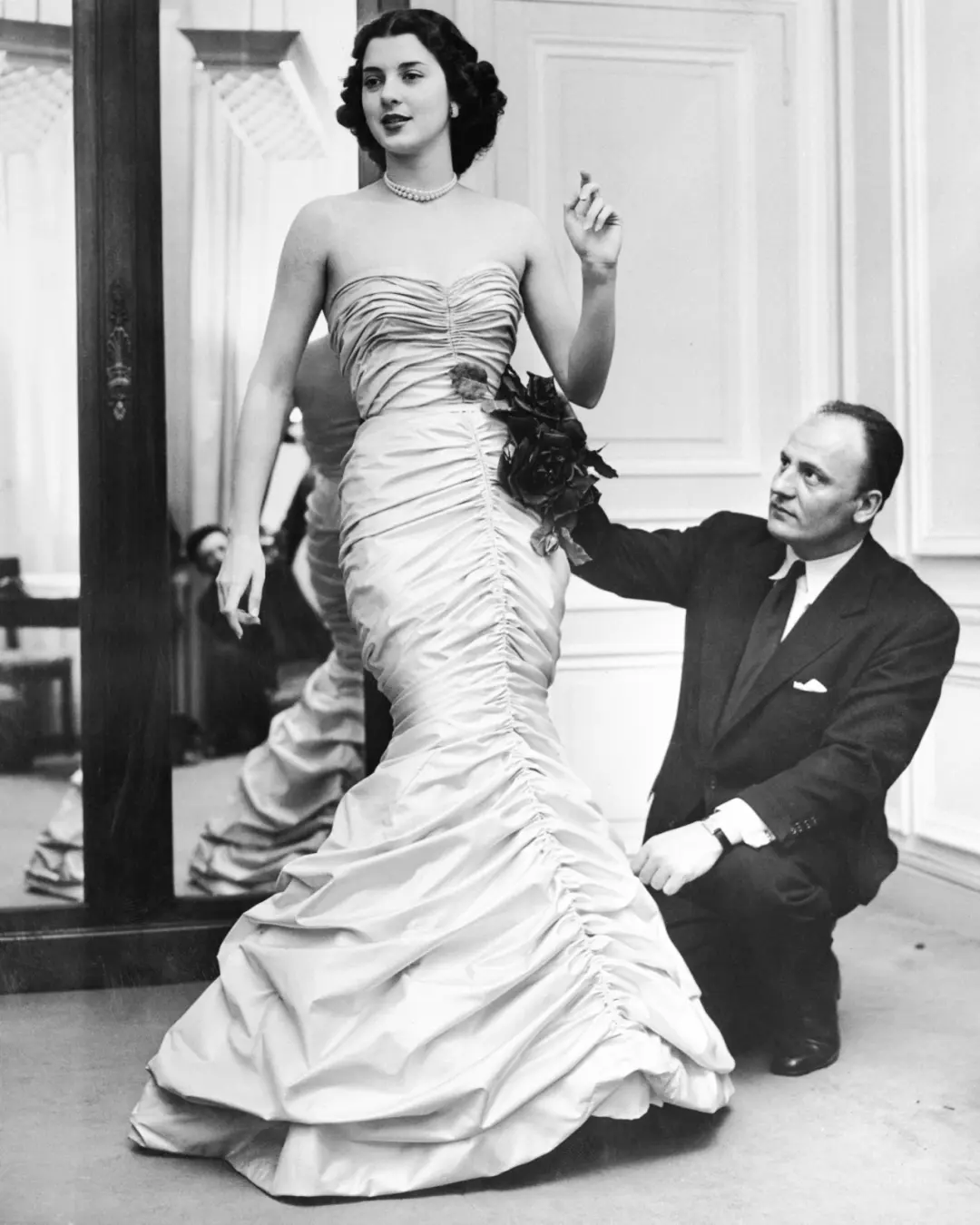 Pierre Balmain in fitting room with Janine Holland Pierre Balmain