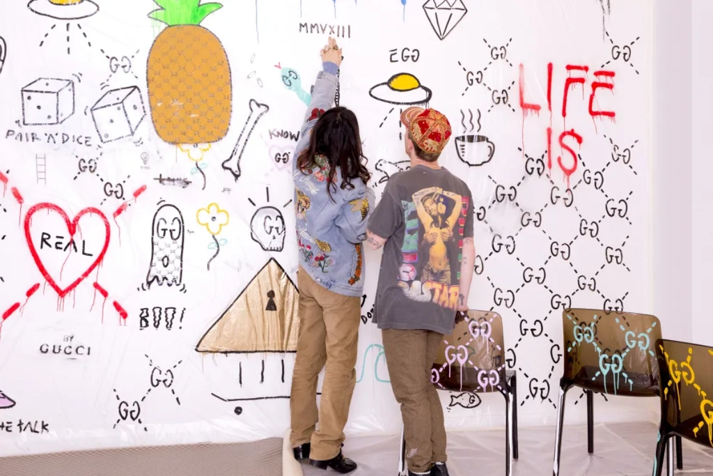 Alessandro Michele and Trevor Andrew (GucciGhost) in Andrew’s temporary studio at the Gucci headquarters in Milan graffiti