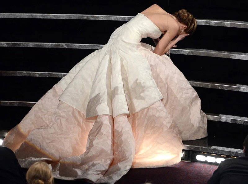 Jennifer Lawrence tripping on the stairs while wearing a Dior Haute Couture gown on her way to accept the Best Actress award at the 85th Academy Awards 2013 Inside the Radical World of Raf Simons 11
