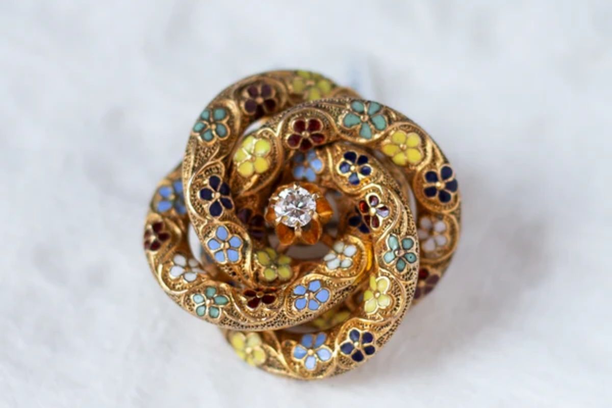 Victorian Enamel jewelry piece: Love Knot Brooch Enamel jewelry is Luxury’s Most Brilliant Return to Color