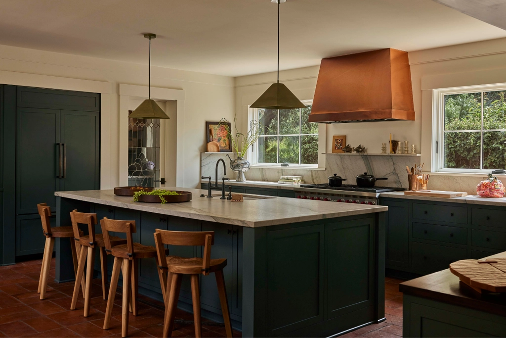 Electric Bowery's kitchen design makes the copper hood the focal point of cooking zone, ventilation, a function, became the centerpiece Ceramic tiles kitchen design