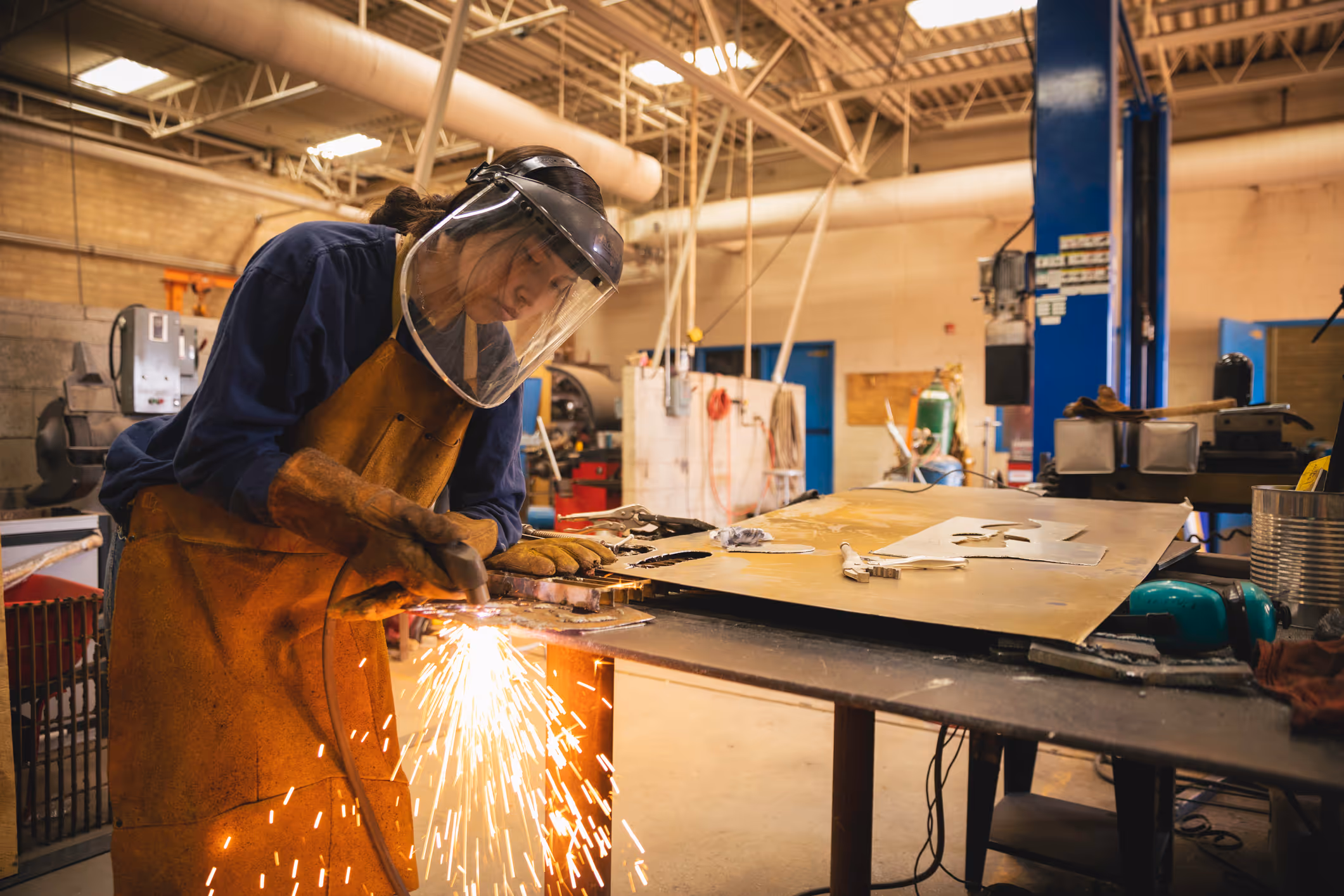 Asian woman welding