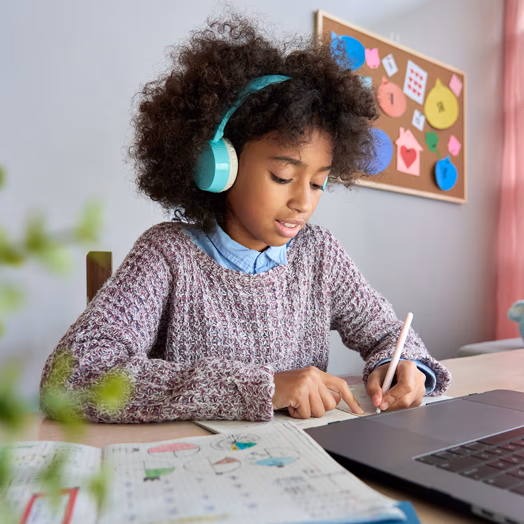 Student completing AI-powered micro-learning for children at home.