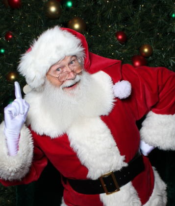 Close-up of Santa Claus wearing a red hat and eyeglasses with a snowy white beard.