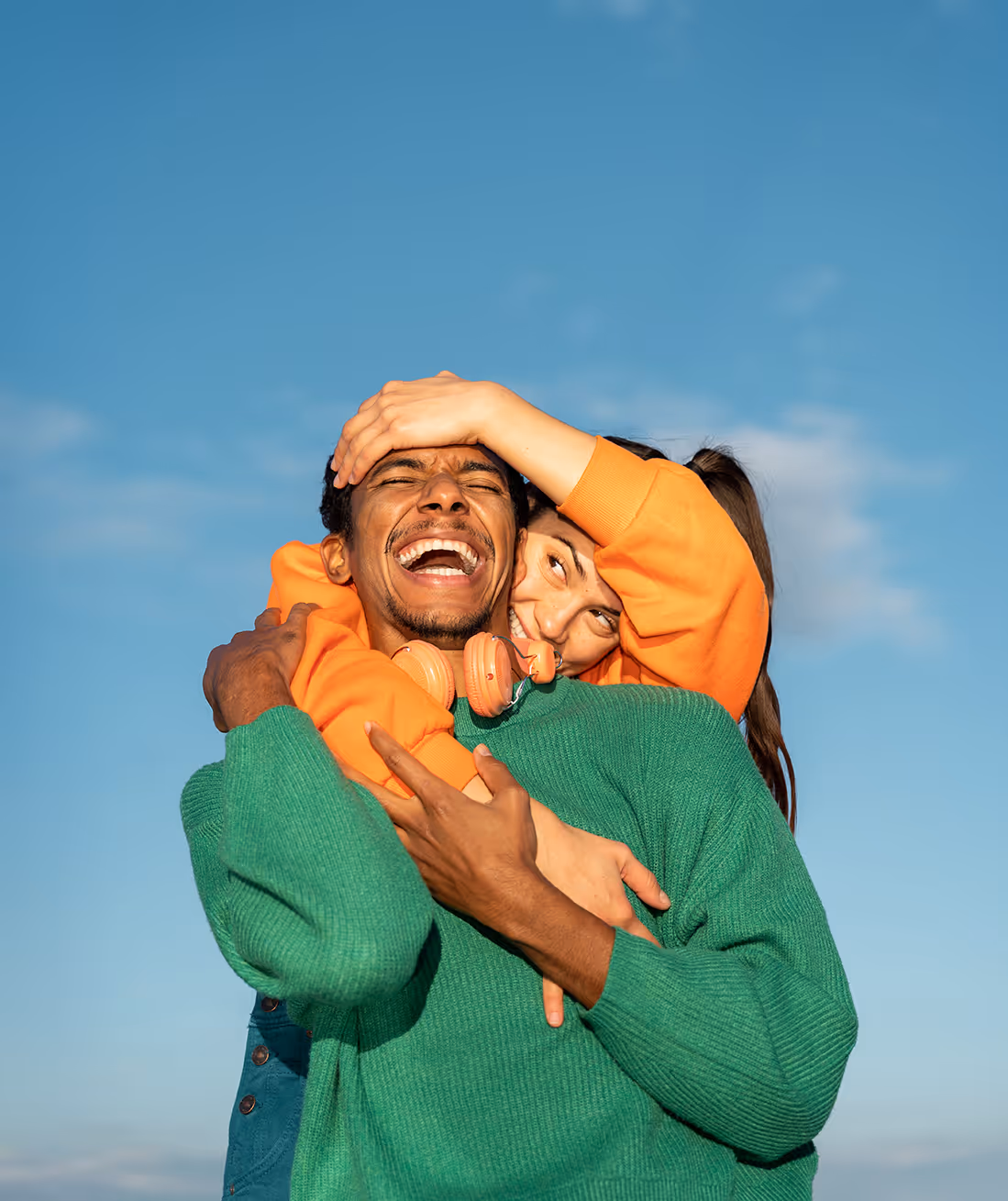 A couple hugs happily on the sun