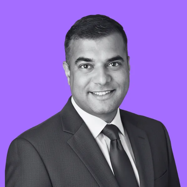 CEO & Co-founder with short, black hair wearing a dark blazer, looking slightly upward, Over 25 years in hi-tech across global markets, named “Master of the Business Pivot” by CEO Today.‍