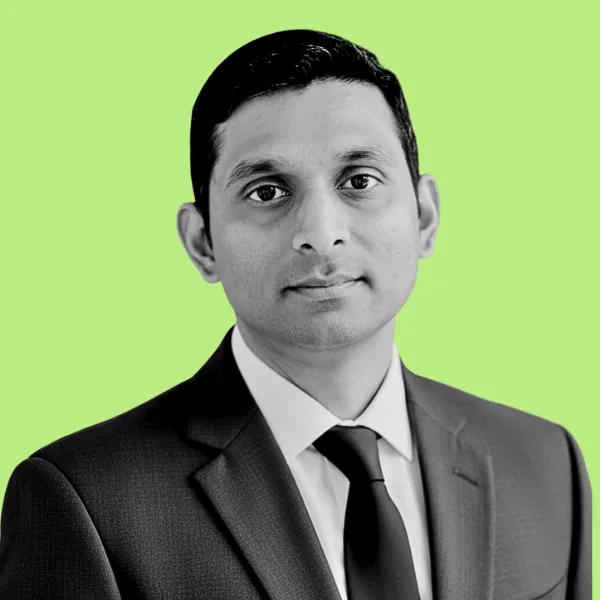 CPO & Co-founder with short, black hair wearing a dark blazer, looking slightly upward., over 15 years in product leadership across SaaS (Mobility, Creator tools) and Consumer devices.