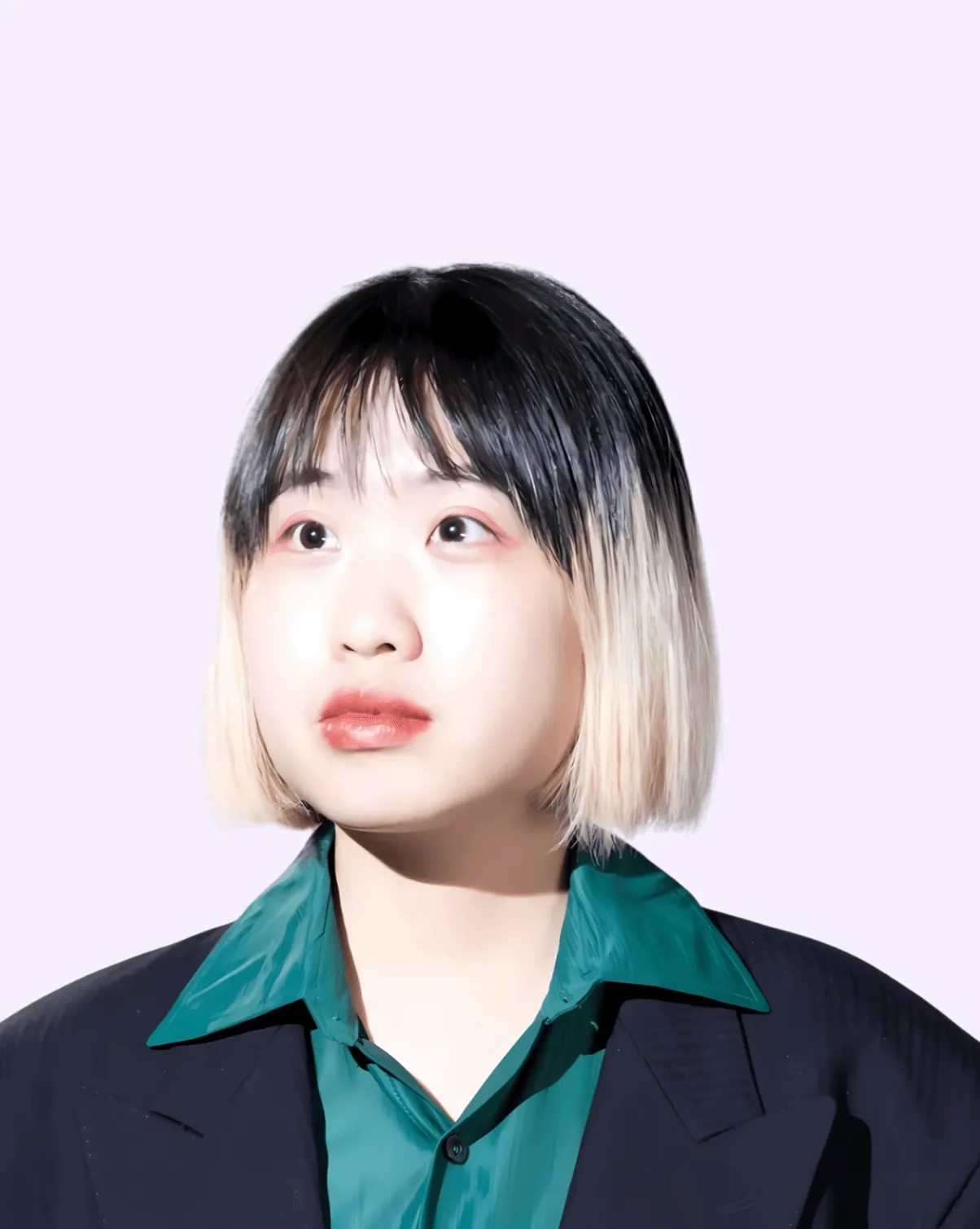 Person with two-toned black and blonde hair in teal and black outfit