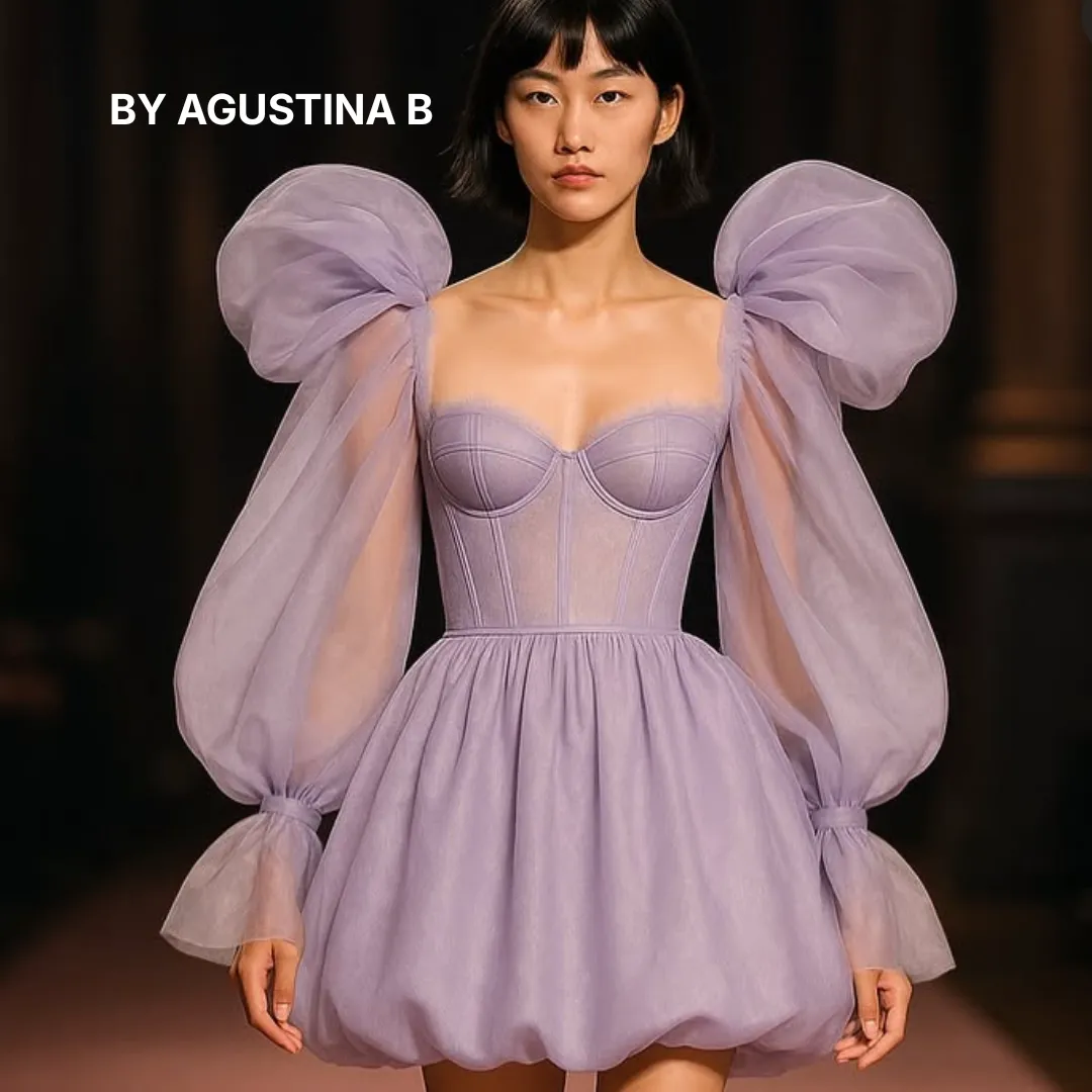 Woman in a purple dress with large pink flower shoulder accents standing near glowing blue tree trunks at night.