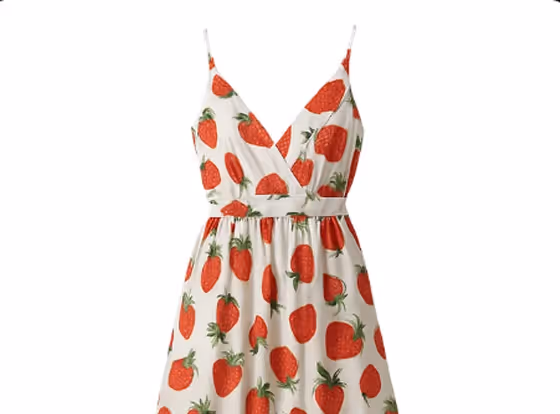 White sleeveless dress with V-neck and red strawberry print pattern.