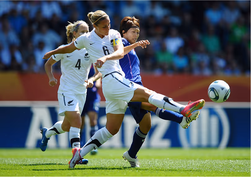 Bex Smith, captain of the New Zealand women’s national football team, challenging an opponent for the ball during an international match.