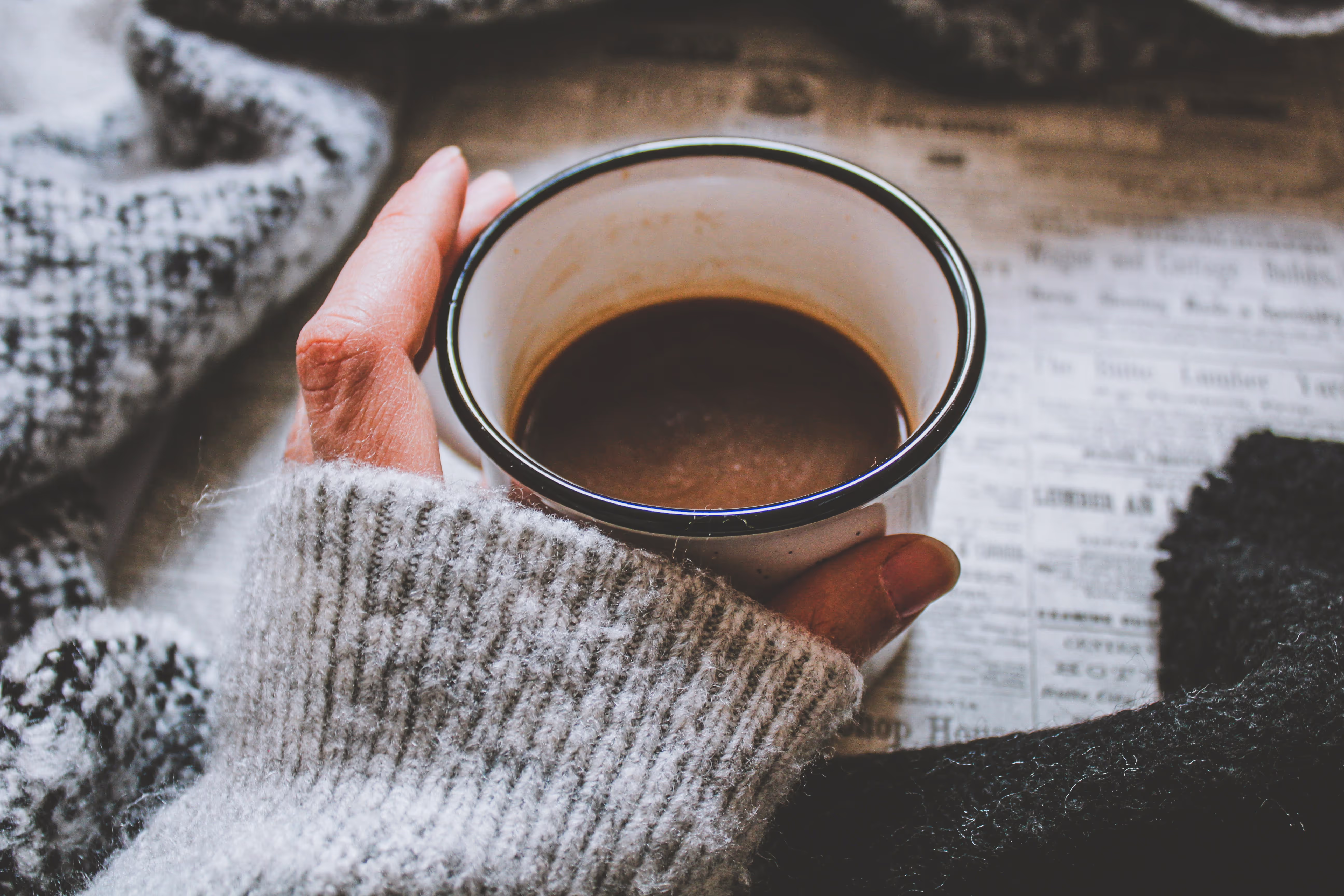 Woman holding cup of coffee