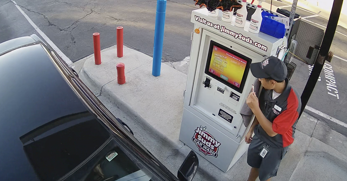 View of a sales interaction at a car wash paystation
