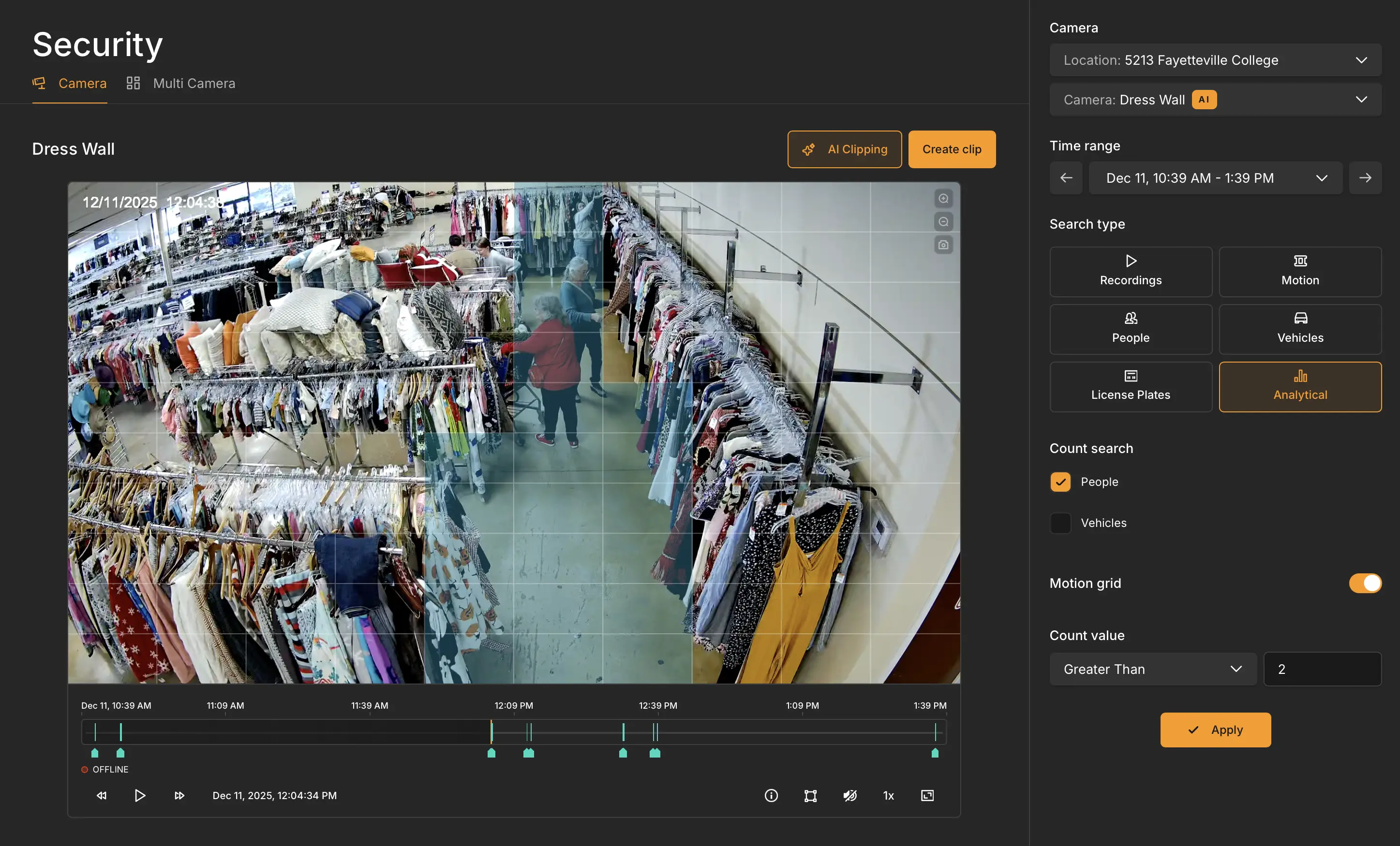 Security camera view with AI motion grid overlay detecting people movement and activity zones inside a retail store.