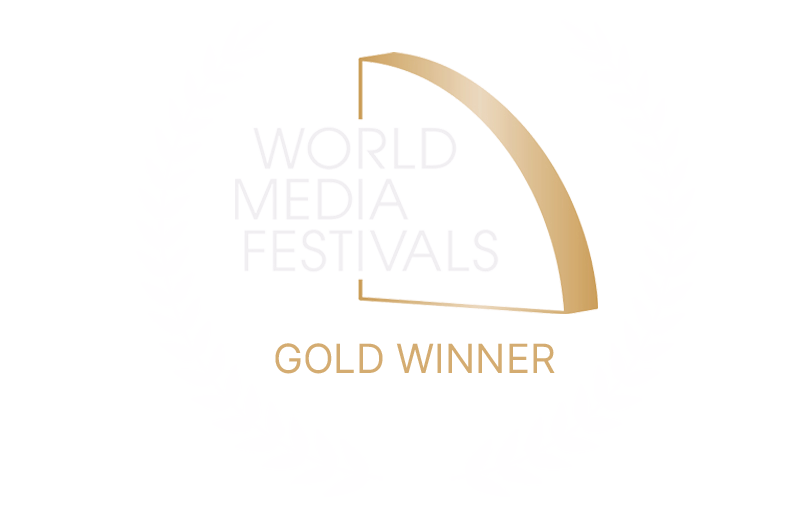 World Media Festivals Gold Winner award logo with a stylized golden arch.