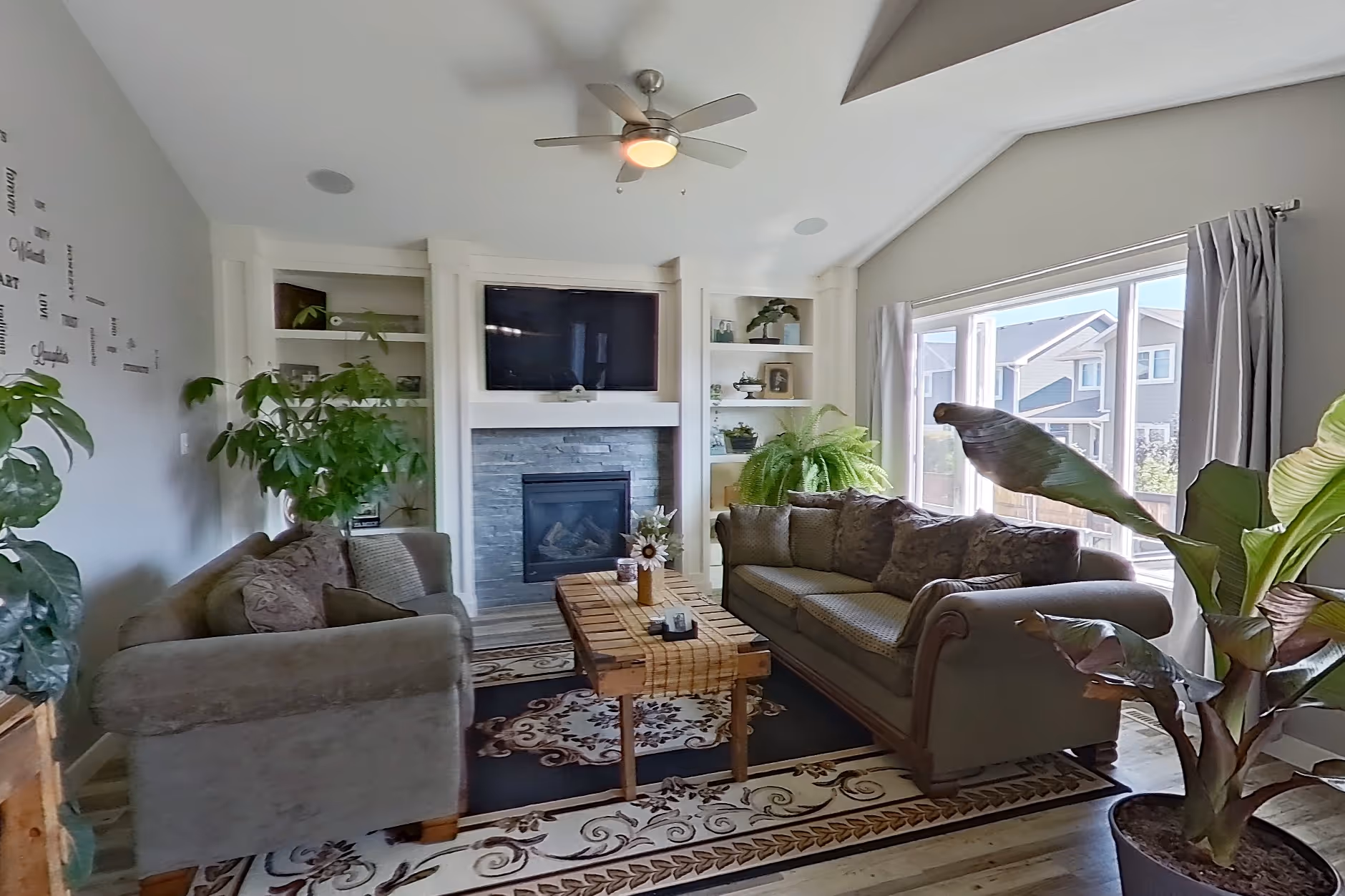 Spacious living room with natural light, photographed for a real estate listing.