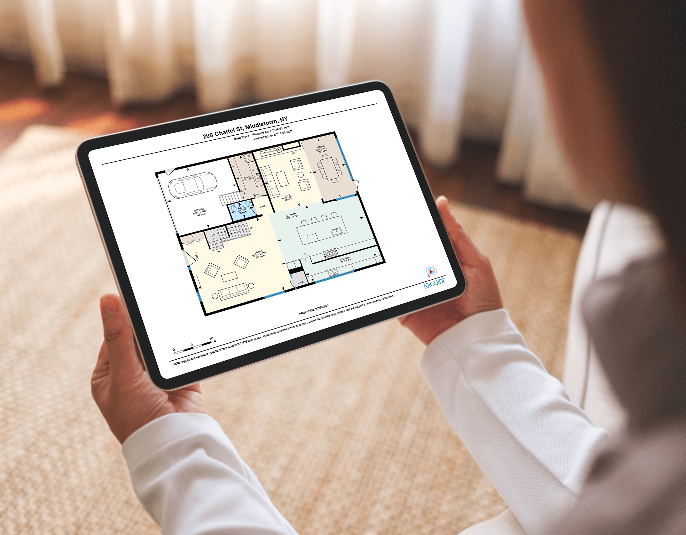 Person holding a tablet displaying a detailed floor plan of a house at 200 Chattel St, Middletown, NY.