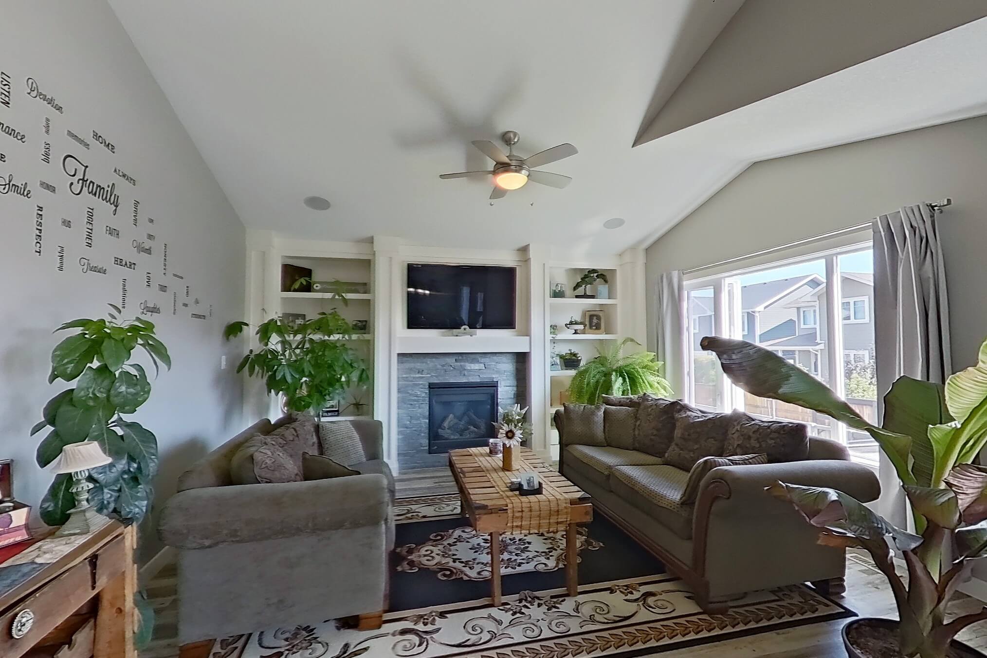 Spacious living room with natural light, photographed for a real estate listing.