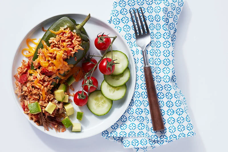 Riceland Spanish Rice with Smoked Shredded Pork Stuffed Poblanos dish