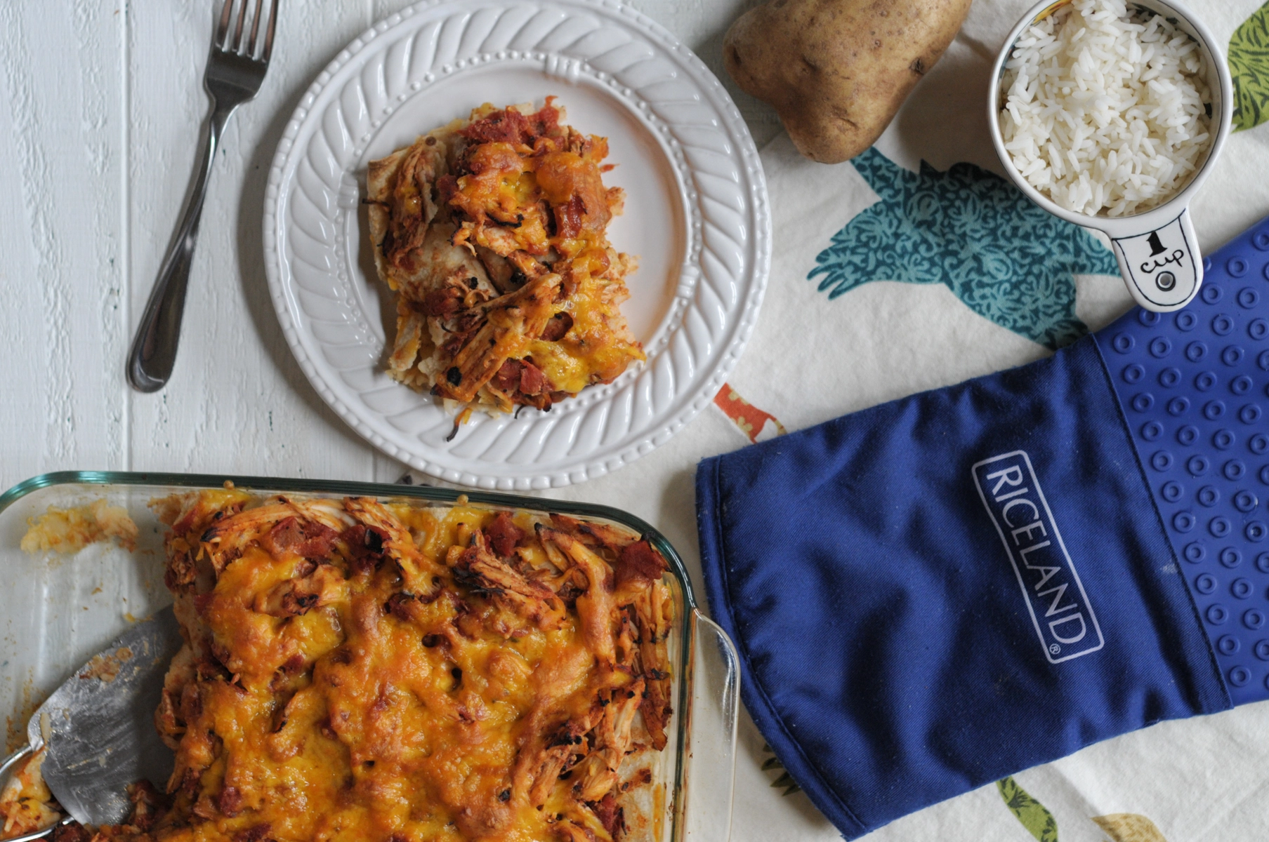 Cheesy Rice and Potato Enchiladas with Shredded Chicken Ragu dish