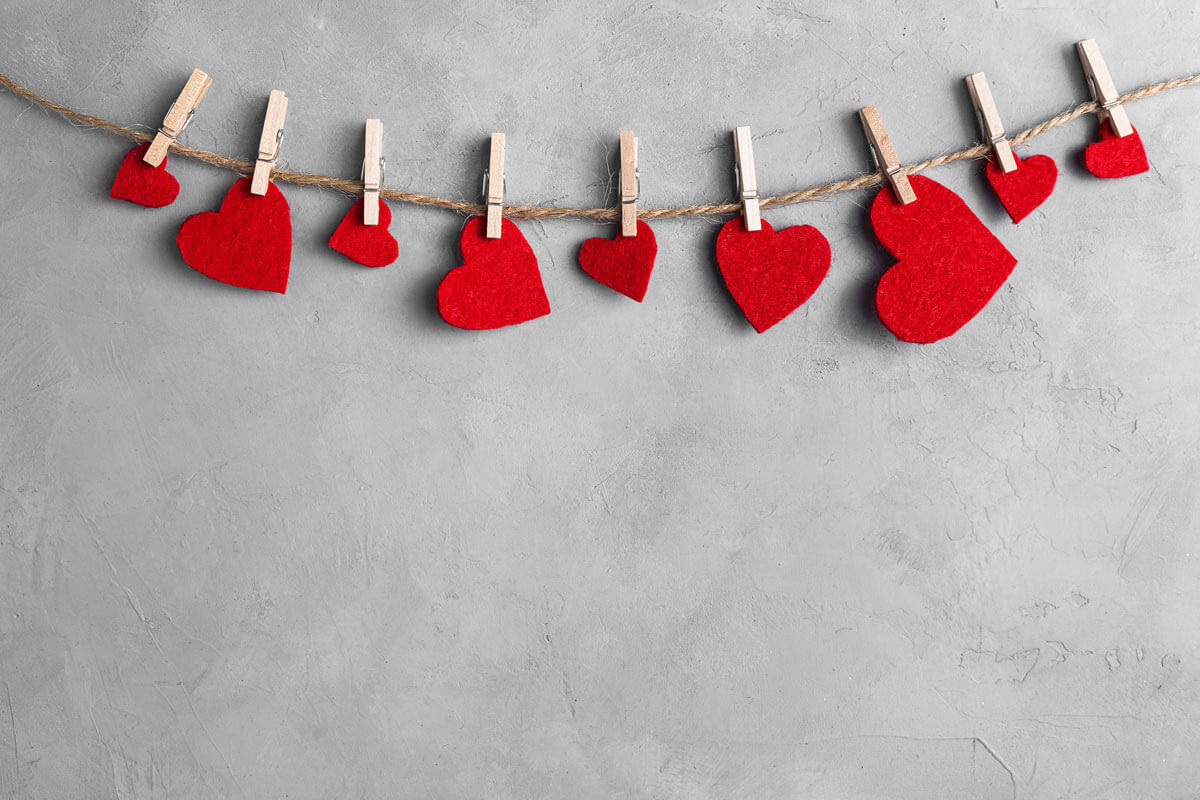 Felt Valentine hearts hanging on a rope with clothes pins