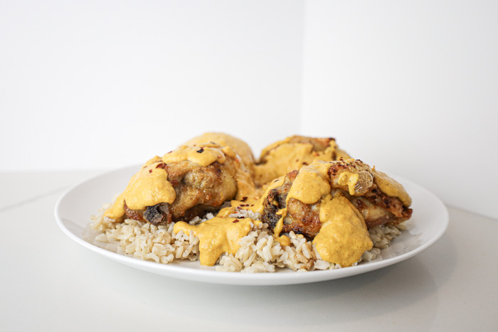 Air Fryer Curry Chicken Thighs Over Brown Rice dish