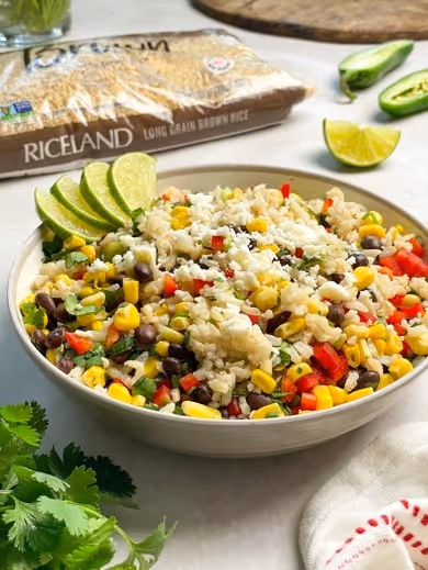 A bowl of rice with vegetables and limesAI-generated content may be incorrect., Picture