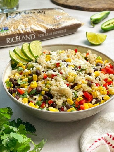 A bowl of rice with vegetables and limesAI-generated content may be incorrect., Picture