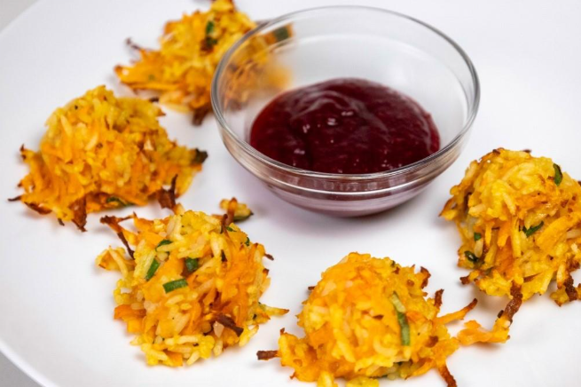 Food on a plate with a bowl of sauceAI-generated content may be incorrect.