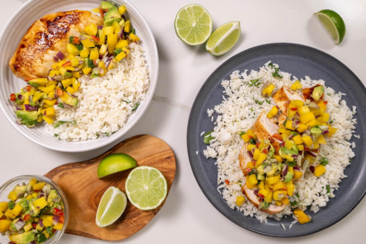 A plate of food with rice and fruitAI-generated content may be incorrect.