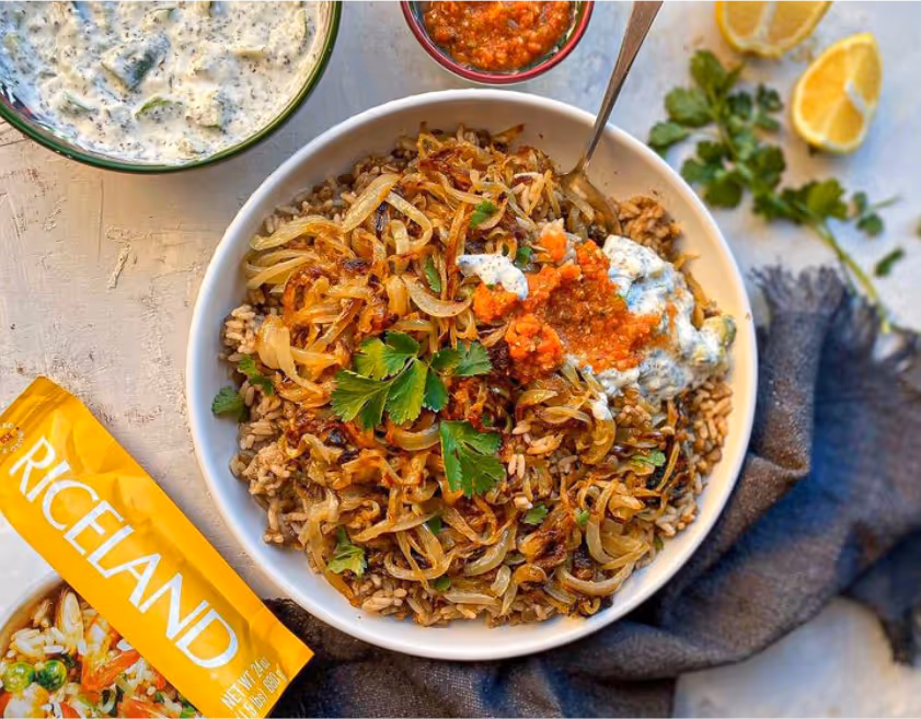 A bowl of food with sauces and lemonsAI-generated content may be incorrect.