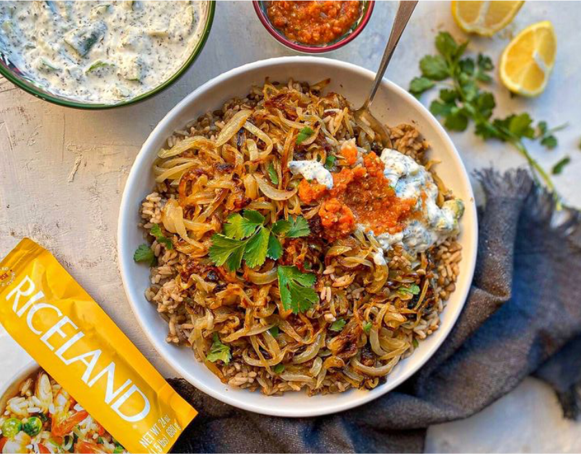 A bowl of food with sauces and lemonsAI-generated content may be incorrect.